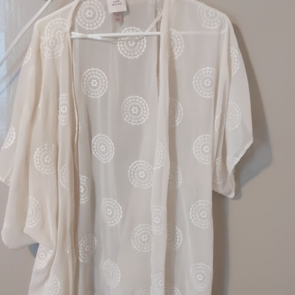 Cream colored, sheer shirt